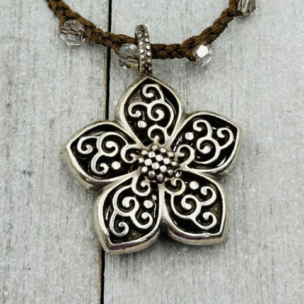 Brighton Silver Toned Flower Reversible Pendant on a Brown Braided Cord. EUC!